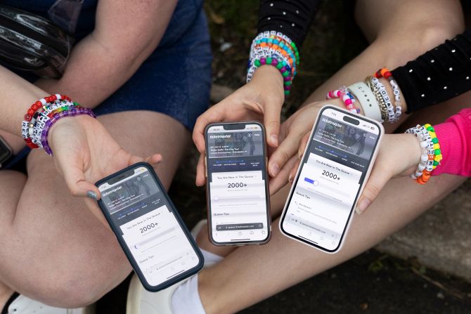Fans show the Ticketmaster queue from the parking lot outside Swift's show in Philadelphia in May 2023. <a href=